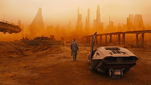 Blade Runner 2049 Futuristic Cityscape with Lone Figure and Sci-Fi Vehicle HD wallpaper