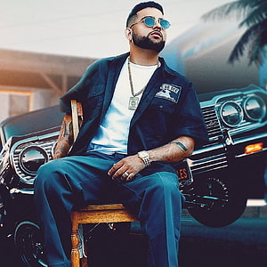 Karan Aujla Portrait in Front of Classic Black Chevrolet with Sunglasses and Gold Chain HD phone wallpaper