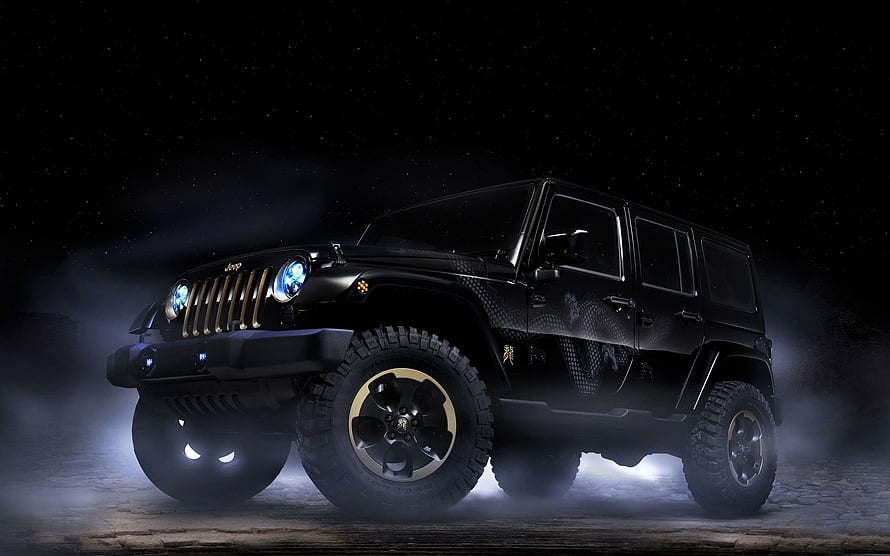 Black Jeep Wrangler with Gold Accents in Dramatic Night Lighting HD wallpaper
