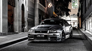 Silver Nissan Skyline GT-R R34 Parked on Urban Street at Night HD wallpaper