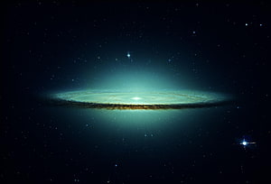Edge-On Spiral Galaxy with Luminous Core and Dust Lane in Deep Space HD wallpaper