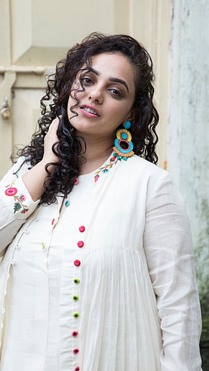 Nithya Menon in Embroidered White Kurta with Colorful Beaded Earrings HD phone wallpaper
