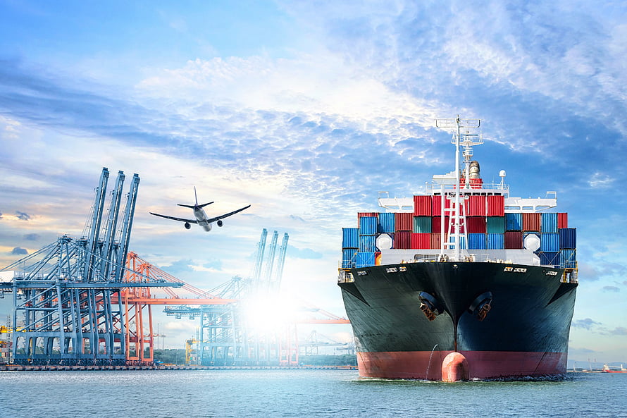 Massive Container Ship Docked at Port with Cargo Cranes and Airplane in Sky HD wallpaper