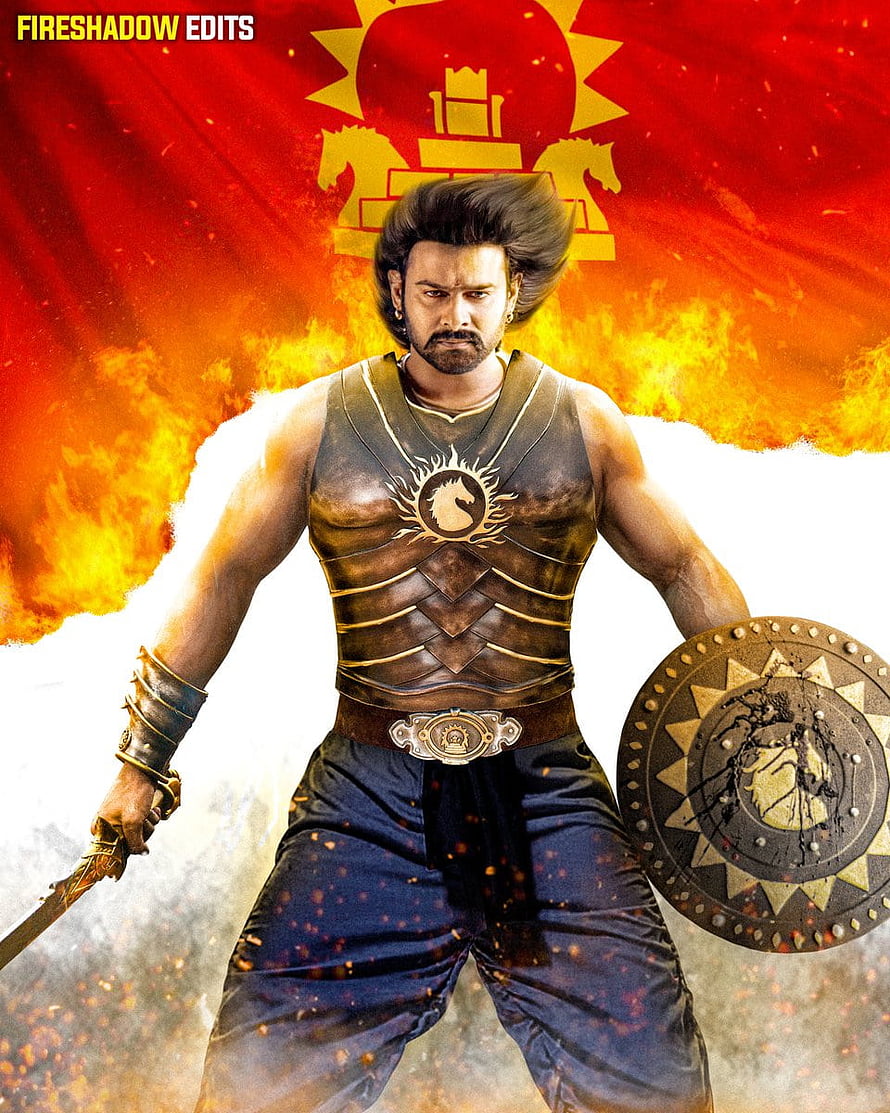 Baahubali 2 warrior in ornate armor holding sword and shield against fiery red backdrop HD phone wallpaper