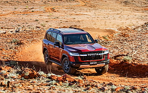 Red Toyota Land Cruiser GR Sport SUV Driving on Dusty Off-Road Desert Trail HD wallpaper