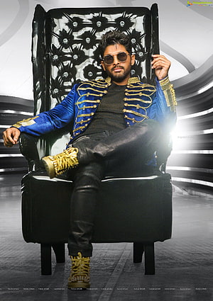 Allu Arjun in a blue military jacket and gold sneakers seated on a black throne chair HD phone wallpaper