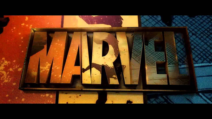 Weathered Marvel Logo Sign on Urban Wall with Warm Lighting HD wallpaper