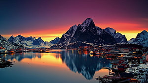 Reine Village in Lofoten Norway at Sunset with Snow-Capped Mountains and Fjord Reflections HD wallpaper