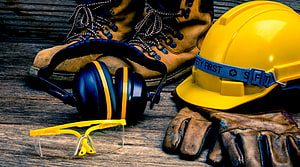 Construction Safety Gear Arrangement with Hard Hat, Boots, and Protective Equipment HD wallpaper