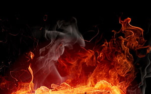 Vivid Orange Flames and Billowing Smoke Against a Dark Background HD wallpaper