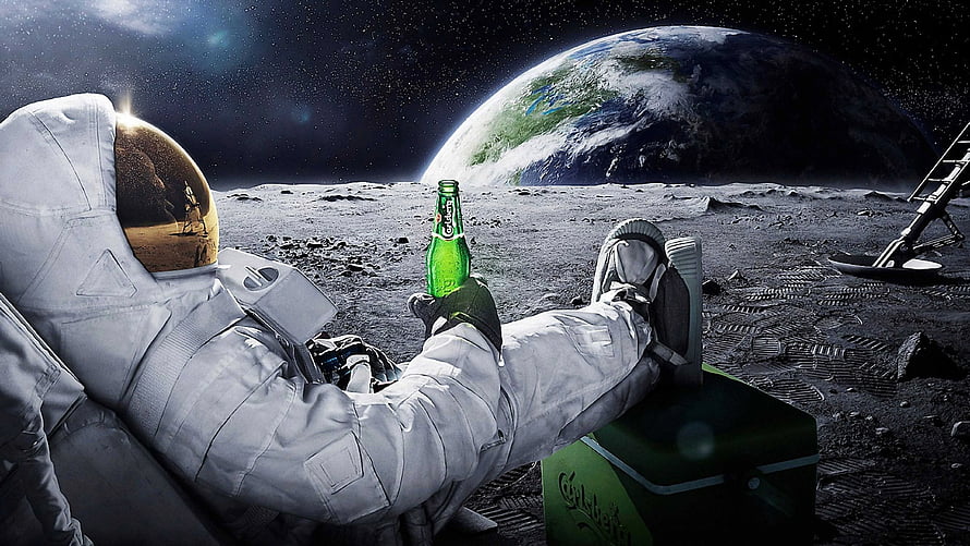 Astronaut Relaxing on the Moon with Carlsberg Beer and Earth in the Background HD wallpaper