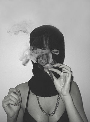 Black and White Portrait of Woman in Balaclava Smoking Cigarette with Chain Necklace HD phone wallpaper