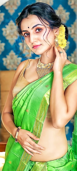 Elegant Indian Woman in Vibrant Green Silk Saree with Gold Jewelry and Floral Hairpiece, Beautiful girl, Sari, Indian HD phone wallpaper