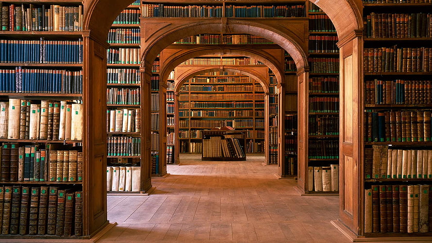 Grand Arched Library Interior With Antique Books And Wooden Shelves HD wallpaper