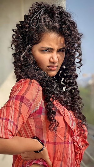 Anupama Parmeshwaran Portrait in Red Plaid Outfit with Curly Hair HD phone wallpaper