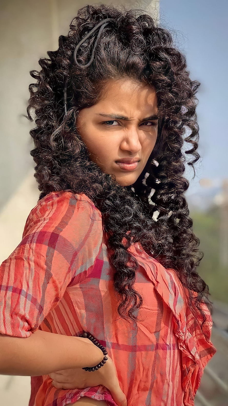 Anupama Parmeshwaran Portrait in Red Plaid Outfit with Curly Hair HD phone wallpaper