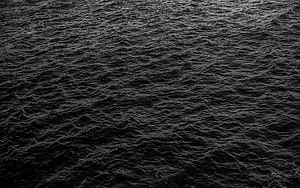 Dark Ocean Surface Texture with Churning Waves and Deep Black Water HD wallpaper