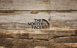 The North Face Logo Carved Into Weathered Rustic Wood Planks HD wallpaper
