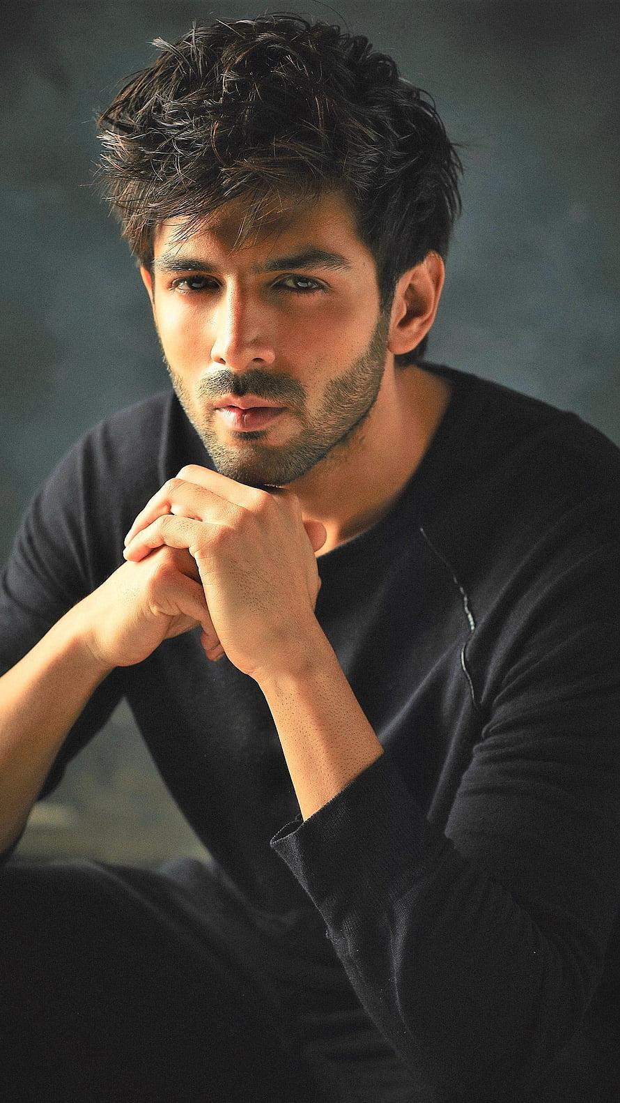 Kartik Aaryan Studio Portrait with Intense Gaze and Contemplative Expression HD phone wallpaper