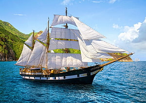 Historic Tall Ship Sailing Through Tropical Waters With Lush Green Hills HD wallpaper