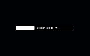 Minimalist Black Background with White Progress Bar and Work in Progress Text HD wallpaper