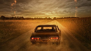 Supernatural Classic Car Driving on Dusty Country Road at Golden Hour HD wallpaper