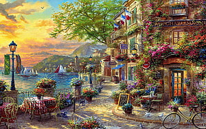 Charming French Riviera Cafe Scene with Flowering Buildings and Coastal Sunset HD wallpaper