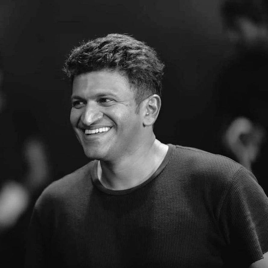 Punit Rajkumar Black and White Portrait Smiling in Dark Knit Shirt HD phone wallpaper