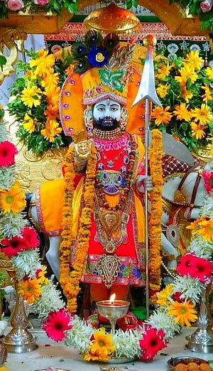 Baba Ramdev Ji Temple Idol Adorned With Marigold Garlands And Sacred Offerings HD phone wallpaper