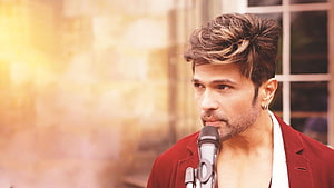 Himesh Reshammiya performing with microphone in red blazer HD wallpaper