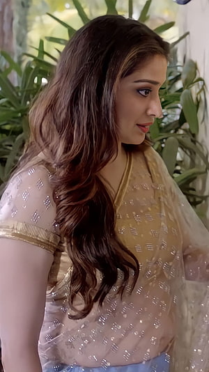 Lakshmi Rai in an elegant gold embroidered saree with long wavy hair HD phone wallpaper