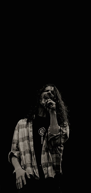 Chris Cornell performing live with microphone in dramatic black and white portrait HD phone wallpaper