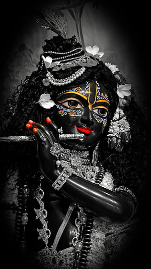 Dark Krishna Portrait with Floral Crown and Ornate Jewelry HD phone wallpaper