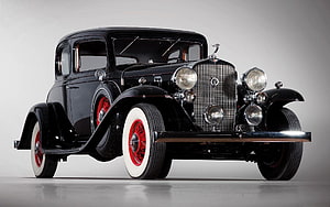 Black 1930s Vintage Coupe with Red Wire Wheels and White Wall Tires HD wallpaper
