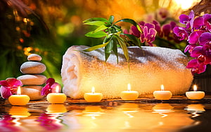 Serene Spa Still Life With Candles, Orchids, and Stacked Stones HD wallpaper