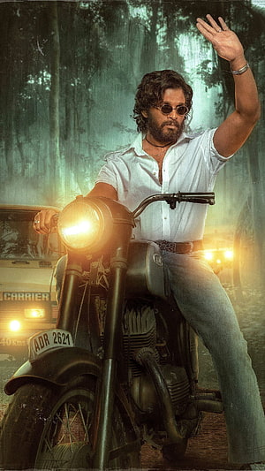 Allu Arjun as Pushpa on a vintage motorcycle in a misty forest with warm cinematic lighting HD phone wallpaper