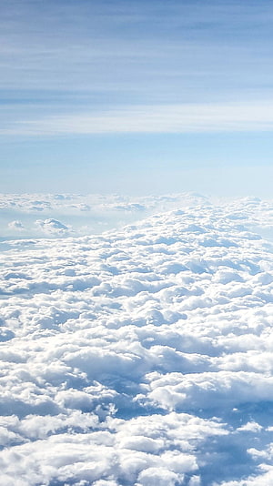 Aerial View of Endless Cumulus Clouds Beneath a Clear Blue Sky HD phone wallpaper