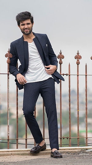 Vijay Devarakonda in a navy blue textured suit with white t-shirt and brown loafers HD phone wallpaper