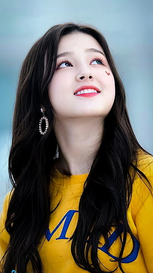 Nancy from Momoland in a yellow top with long dark hair and pearl earrings HD phone wallpaper