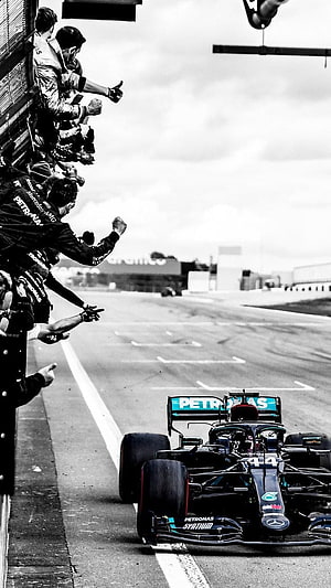 Lewis Hamilton Mercedes F1 Car Crossing the Finish Line with Team Celebration HD phone wallpaper