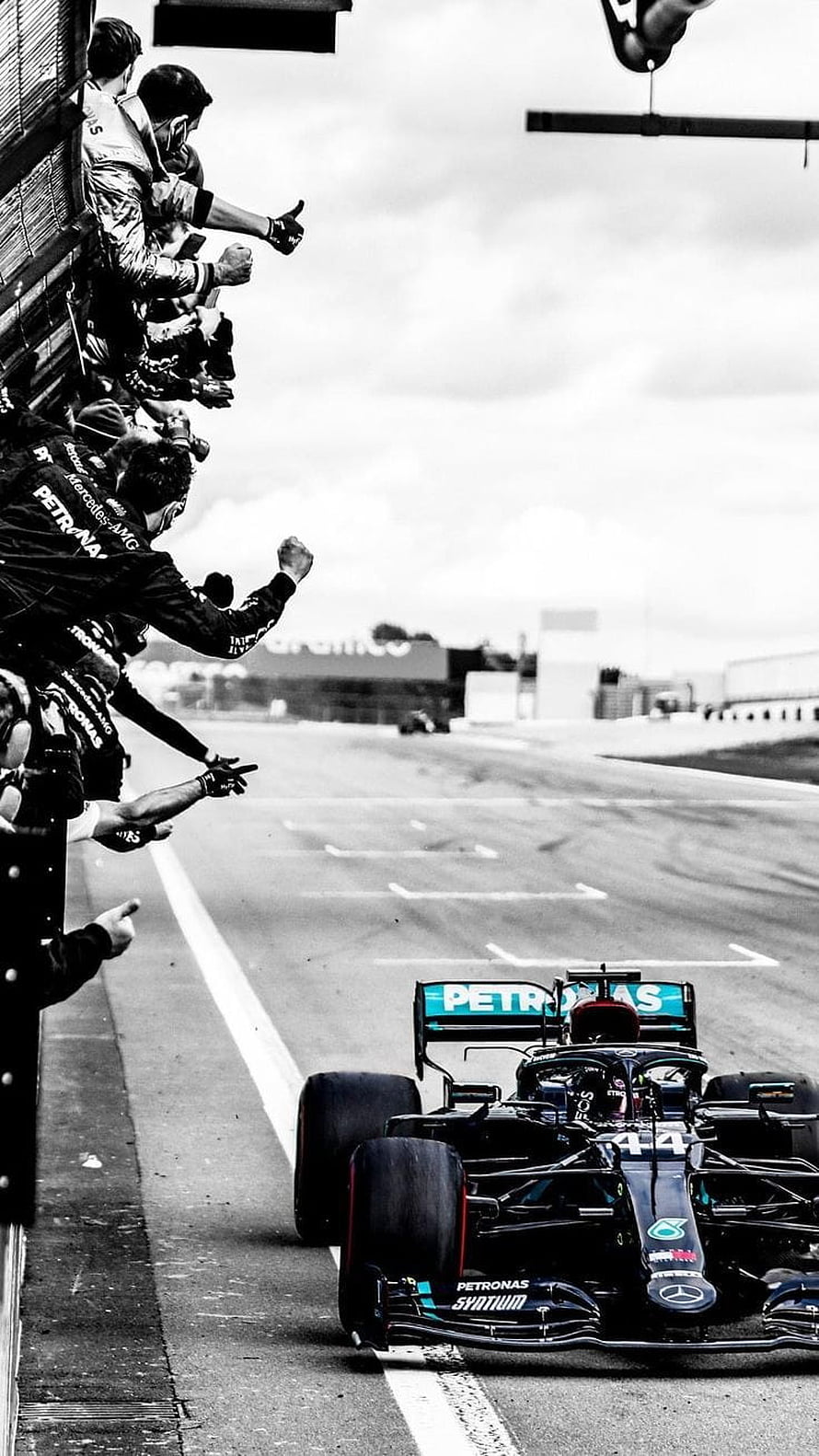 Lewis Hamilton Mercedes F1 Car Crossing the Finish Line with Team Celebration HD phone wallpaper