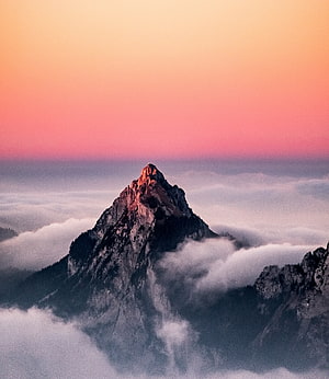 Alpine Mountain Peak Rising Above Sea of Clouds at Sunset in Switzerland HD phone wallpaper
