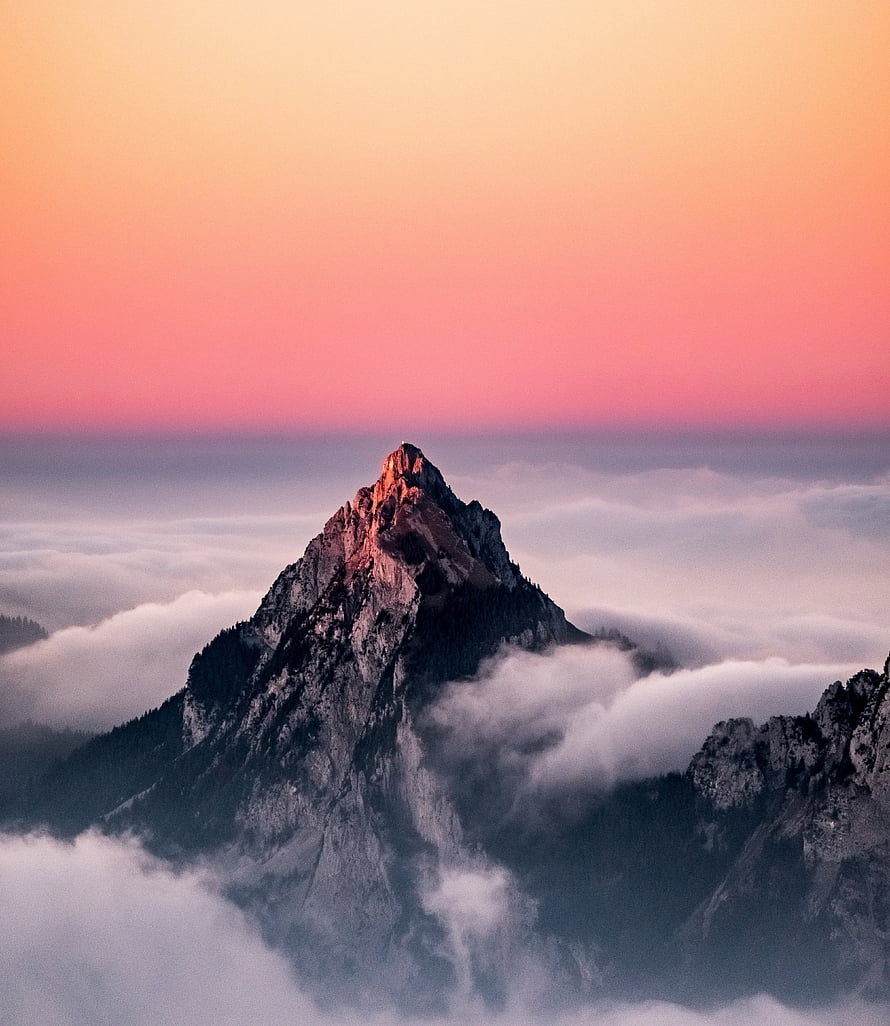 Alpine Mountain Peak Rising Above Sea of Clouds at Sunset in Switzerland HD phone wallpaper