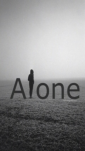 Solitary Figure Standing in Misty Field with Large Typography Overlay HD phone wallpaper