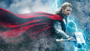 Thor Wielding Mjolnir in a Stormy Battle Scene with Flowing Red Cape HD wallpaper