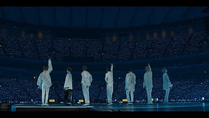 BTS Concert Stage View With Sea Of Blue Light Sticks In Stadium HD wallpaper