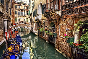 Venice Canal Scene with Ornate Gondola and Historic Architecture HD wallpaper