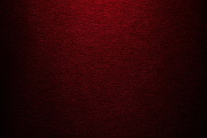 Dark Red Textured Surface with Subtle Grain and Vignette for Moody Backgrounds HD wallpaper