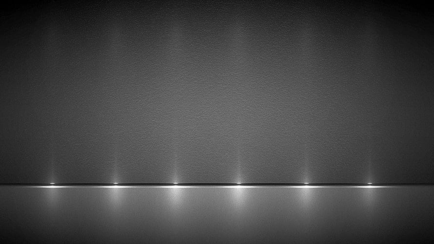 Minimalist Grey Horizon with Soft Light Reflections on a Dark Textured Surface HD wallpaper