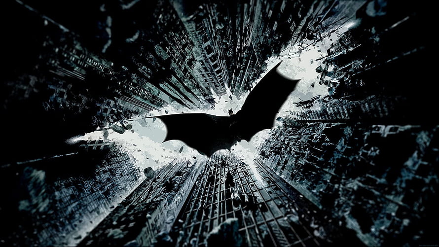 Batman Silhouette Soaring Through a Dark Fractured Cityscape HD wallpaper